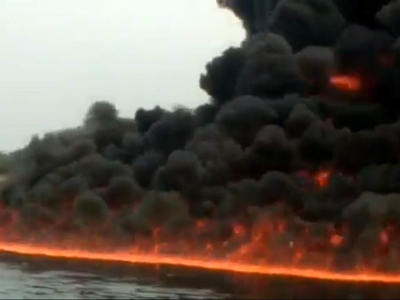 Burhi Dihing river caught fire at Naharkatia in Assam allegedly ...